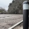 20W Black Dome LED Bollard providing exterior lighting with 3000K warm white color temperature.