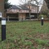 2700K Black Dome LED Bollard with root mounting for outdoor use.